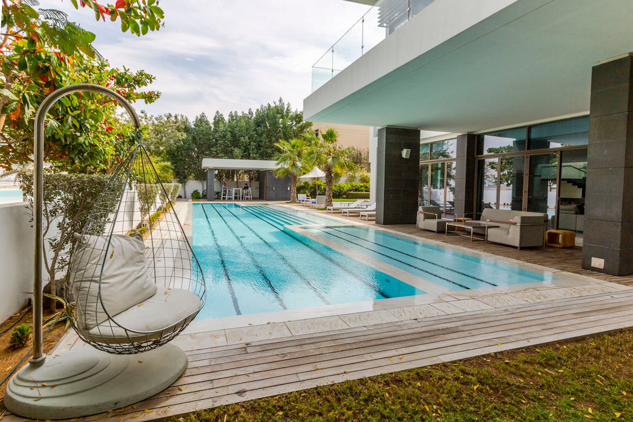 heros-img Explore a modern luxury villa featuring a sleek swimming pool and spacious terrace in Dubai.